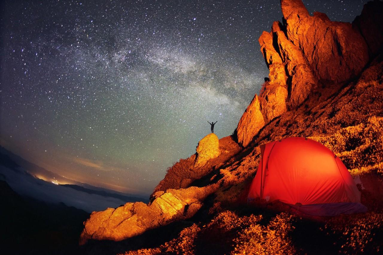 Tent and the Milky Way with mountain scenery